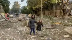 Massive Russian attack on cities across Ukraine kills at least 14 people