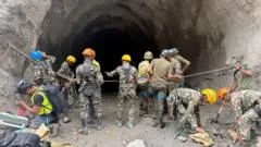 Nepal rescuers blast hillside in search of hydropower workers as families wait anxiously
